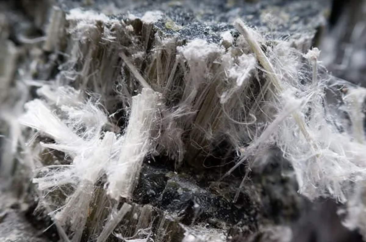 Close-up of white chrysotile asbestos fibers in rock