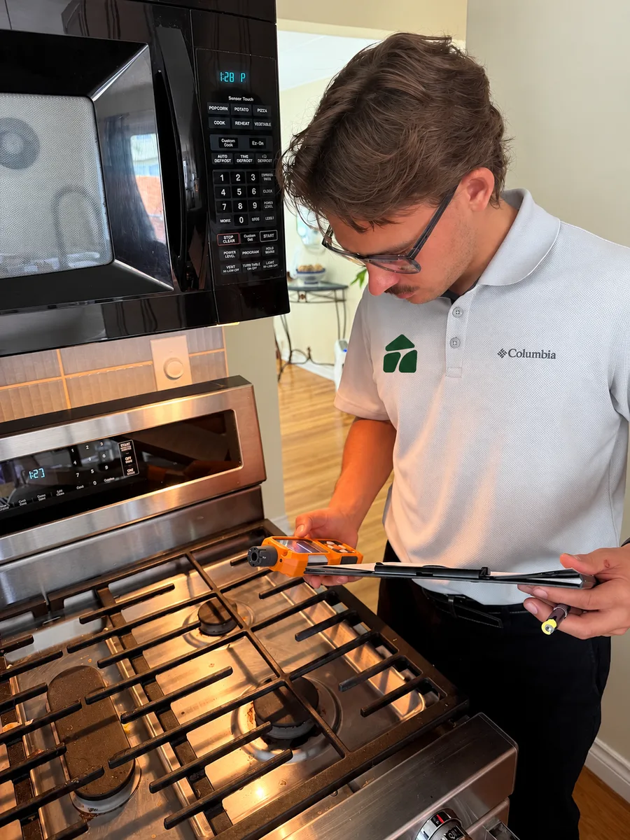 Hunter measuring a gas stove for combustion gases